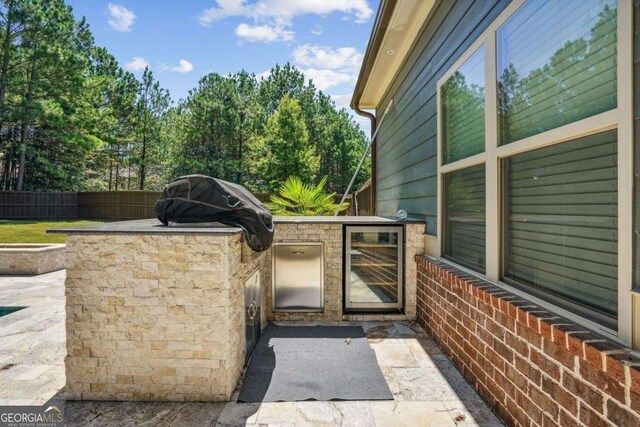 view of patio featuring a grill and exterior kitchen