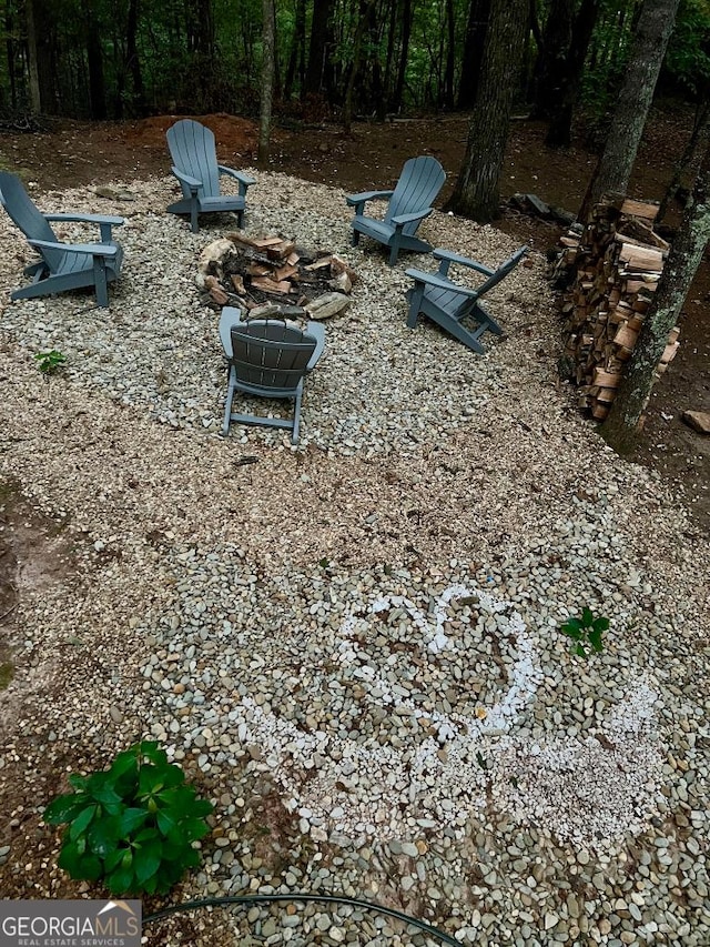 exterior details featuring an outdoor fire pit