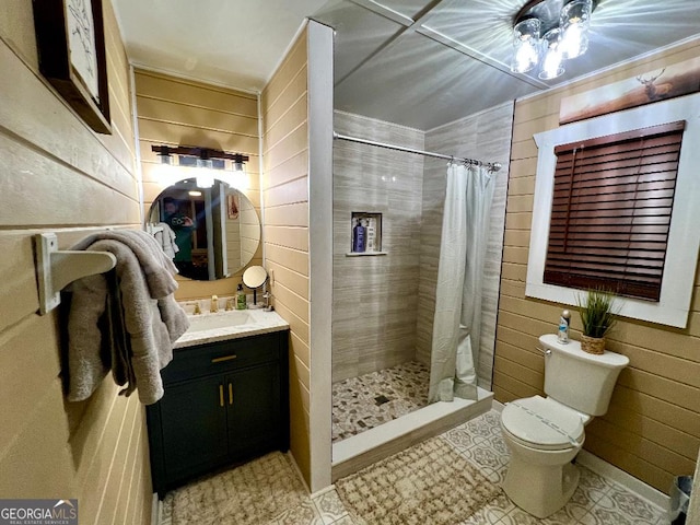 bathroom featuring vanity, wooden walls, tile patterned flooring, toilet, and curtained shower