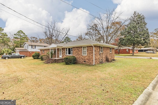 ranch-style home with a front lawn