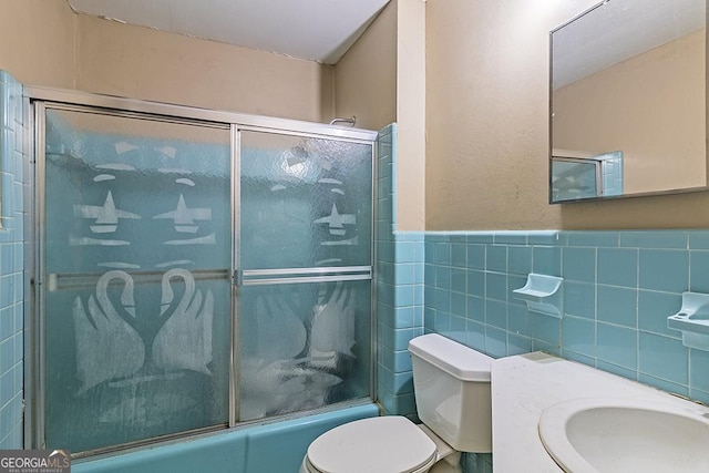 bathroom with shower / bath combination with glass door, toilet, and tile walls