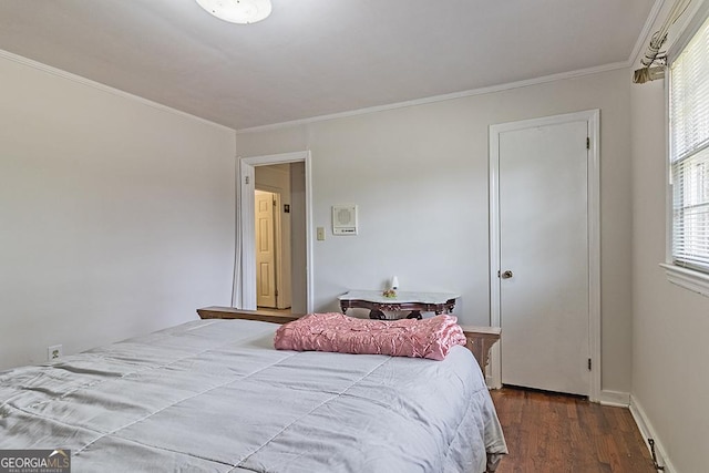 bedroom with wood-type flooring, crown molding, and multiple windows