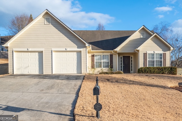 ranch-style house featuring a garage