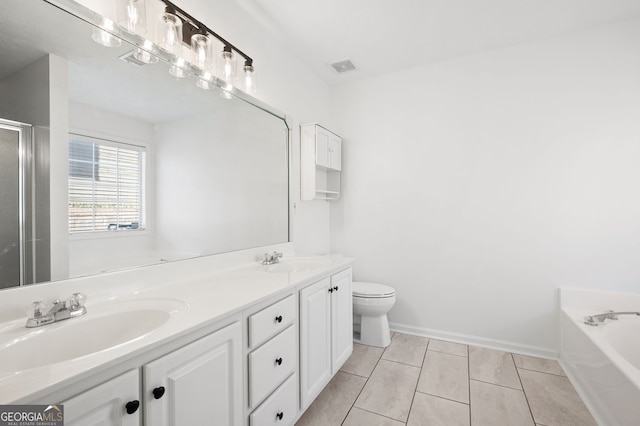 full bathroom featuring tile patterned floors, independent shower and bath, vanity, and toilet