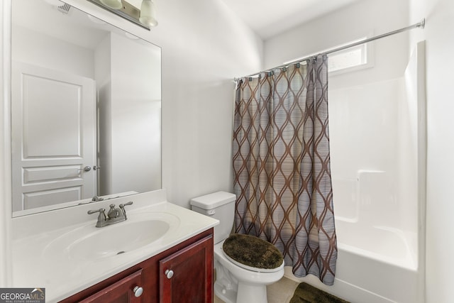 full bathroom with vanity, toilet, and shower / tub combo with curtain