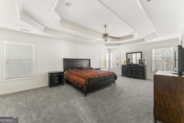 bedroom featuring a tray ceiling, ceiling fan, light colored carpet, and ornamental molding