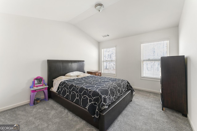 carpeted bedroom with lofted ceiling and multiple windows