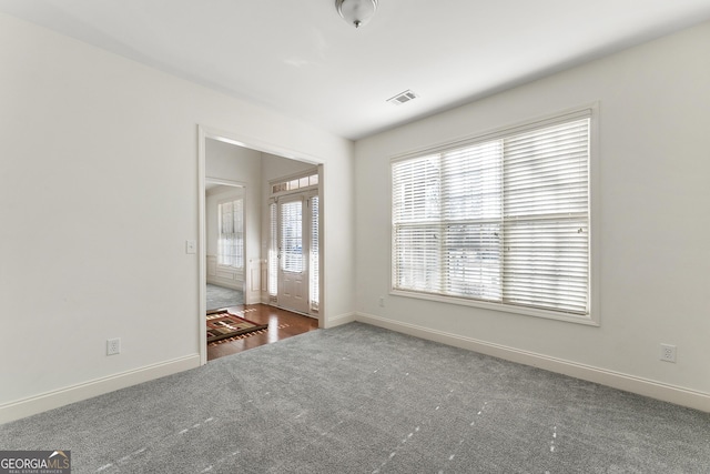 empty room featuring dark hardwood / wood-style flooring