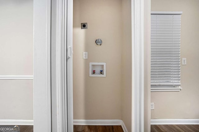 clothes washing area with hookup for a washing machine, dark hardwood / wood-style floors, and electric dryer hookup