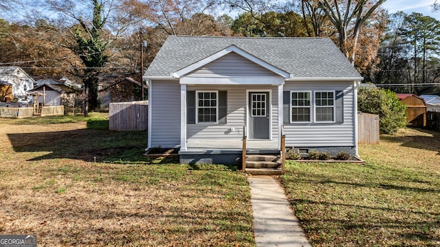 bungalow-style house with a front yard