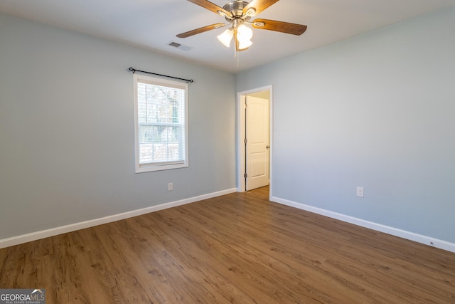 spare room featuring ceiling fan and wood-type flooring