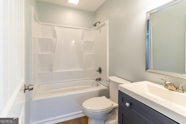 full bathroom featuring vanity, toilet, wood-type flooring, and bathtub / shower combination