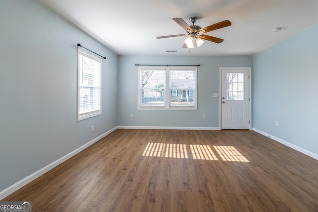 interior space with hardwood / wood-style floors, ceiling fan, and a healthy amount of sunlight