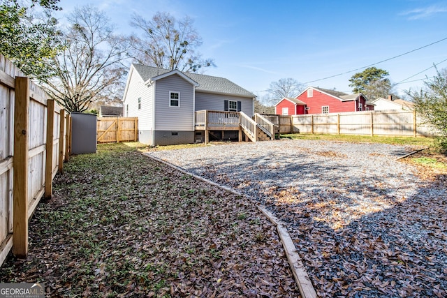 rear view of house with a deck