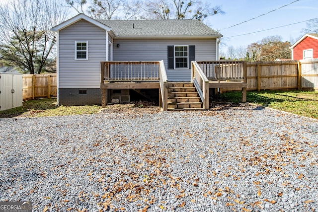 back of house featuring a deck