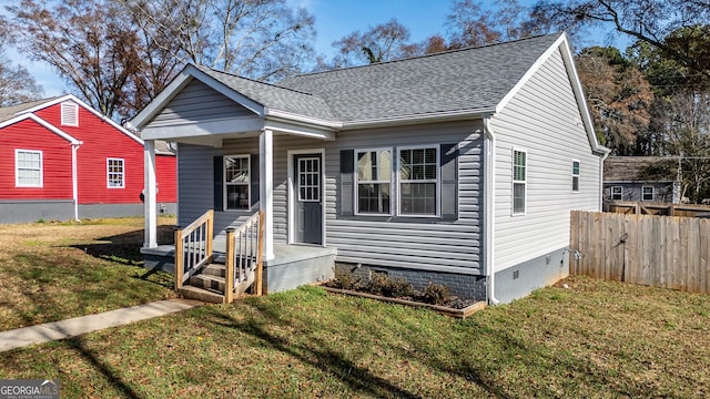 bungalow-style home with a front lawn