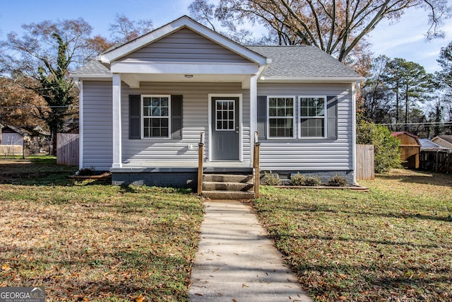 bungalow-style house with a front lawn