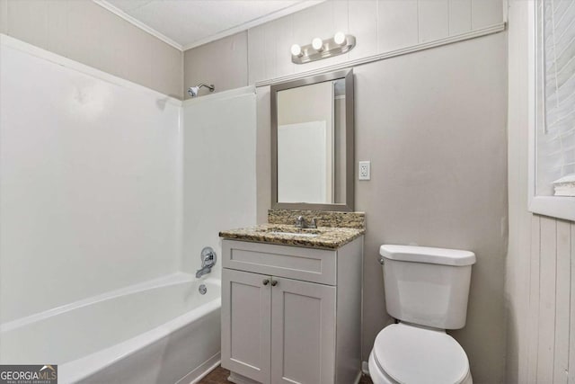 full bathroom with vanity, wood walls, toilet, ornamental molding, and shower / bath combination