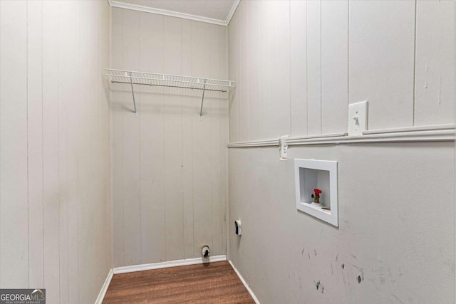 laundry room featuring wooden walls, washer hookup, and dark hardwood / wood-style floors