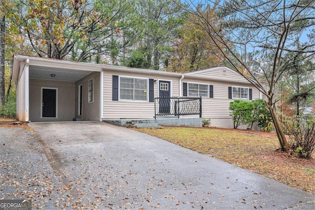 ranch-style house with a carport