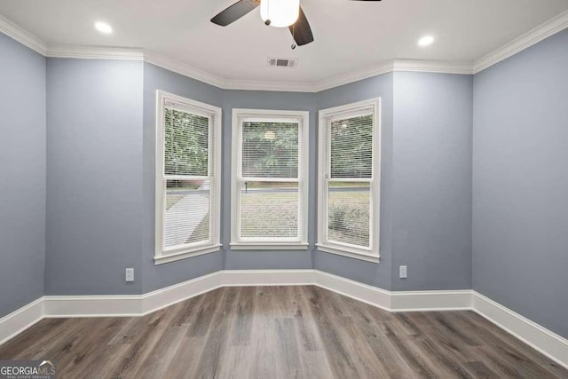 spare room with ceiling fan, wood-type flooring, and crown molding