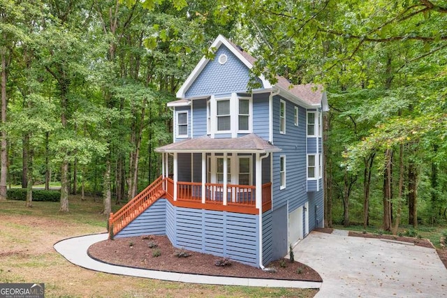 view of front of home featuring a porch and a garage