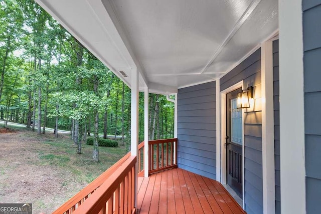 wooden terrace featuring a porch