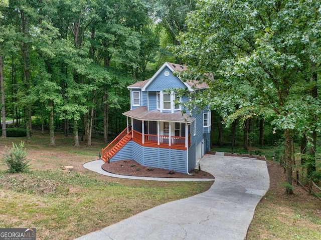 view of jungle gym with covered porch and a yard