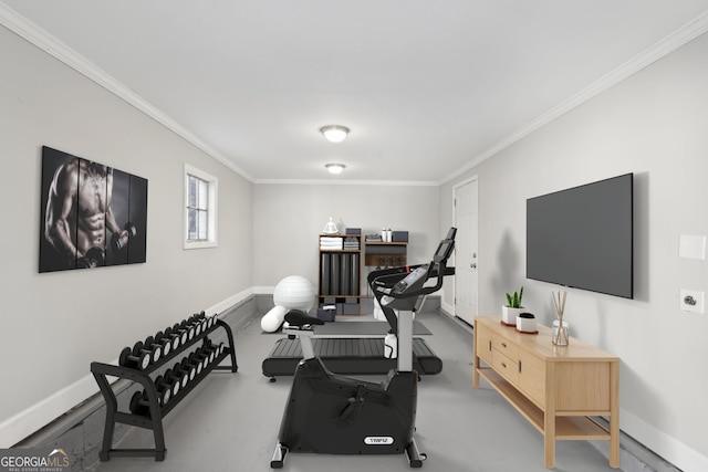 exercise area featuring crown molding