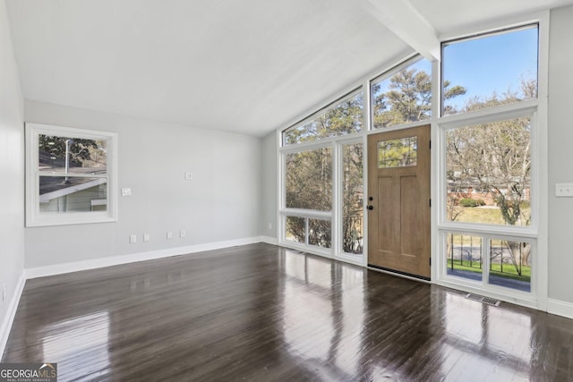 interior space with vaulted ceiling with beams