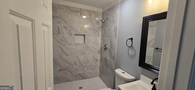 bathroom featuring tiled shower, vanity, and toilet