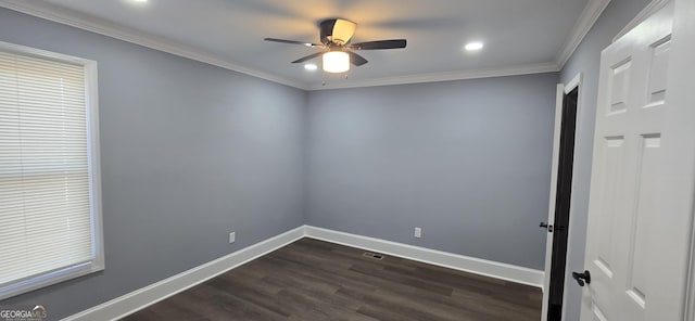 empty room with ornamental molding, ceiling fan, and dark wood-type flooring