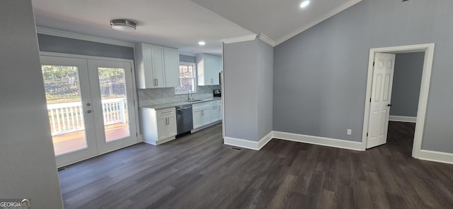 kitchen with french doors, white cabinets, sink, stainless steel dishwasher, and dark hardwood / wood-style flooring