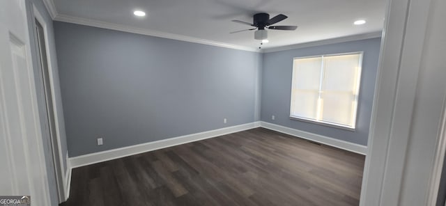 spare room with dark hardwood / wood-style floors, ceiling fan, and ornamental molding