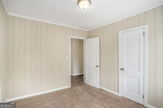 unfurnished bedroom with carpet flooring and ornamental molding