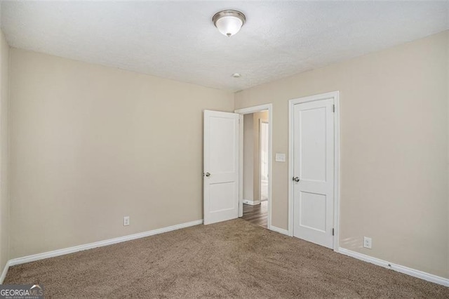 empty room with carpet floors