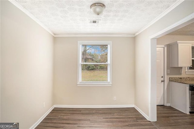 unfurnished dining area with a textured ceiling, crown molding, and dark hardwood / wood-style floors