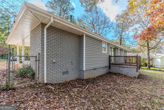 view of property exterior featuring a wooden deck