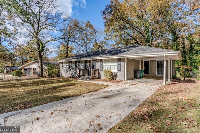 ranch-style home featuring a front yard and a carport