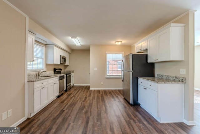 kitchen featuring white cabinetry, dark hardwood / wood-style flooring, and appliances with stainless steel finishes