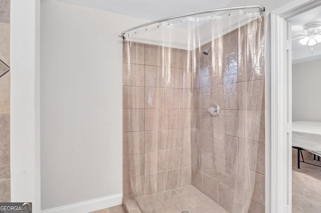 bathroom featuring a shower with curtain and ceiling fan