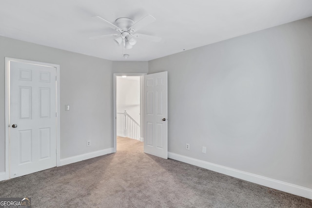 unfurnished bedroom with carpet flooring, a closet, and ceiling fan