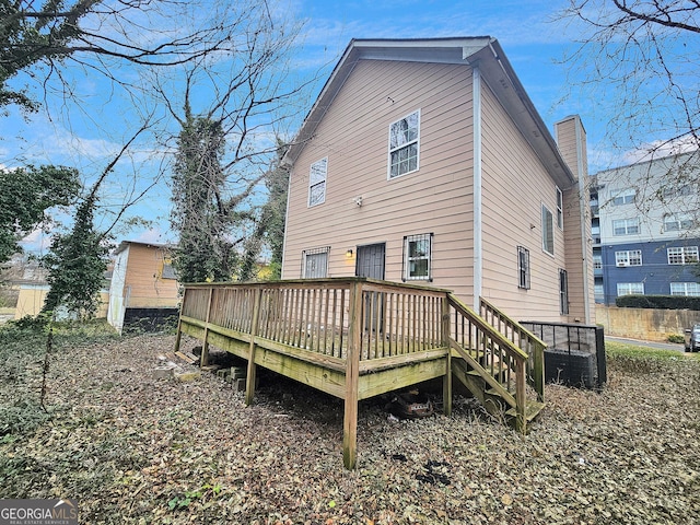 back of property featuring a deck