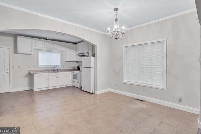 kitchen with white cabinets, pendant lighting, white appliances, and sink