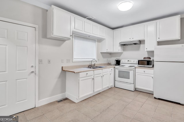 kitchen featuring white cabinets, white appliances, light tile patterned flooring, and sink