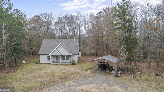 view of front of property featuring a porch and a carport