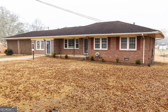 single story home featuring a carport