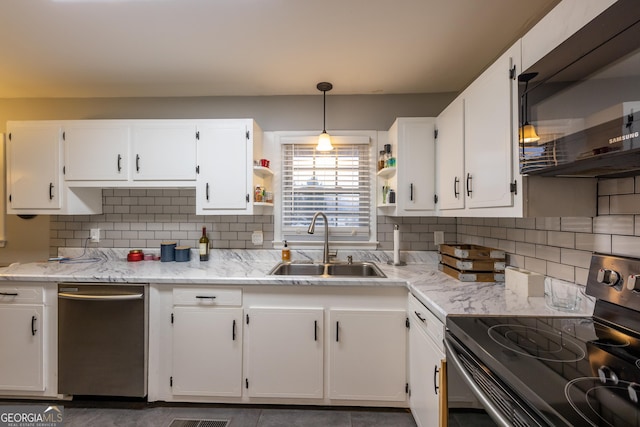 kitchen featuring sink, white cabinets, hanging light fixtures, light stone counters, and stainless steel electric range