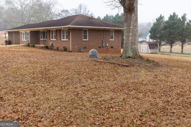 ranch-style home with a front lawn