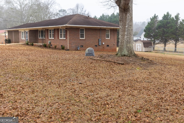 view of home's exterior featuring a storage shed